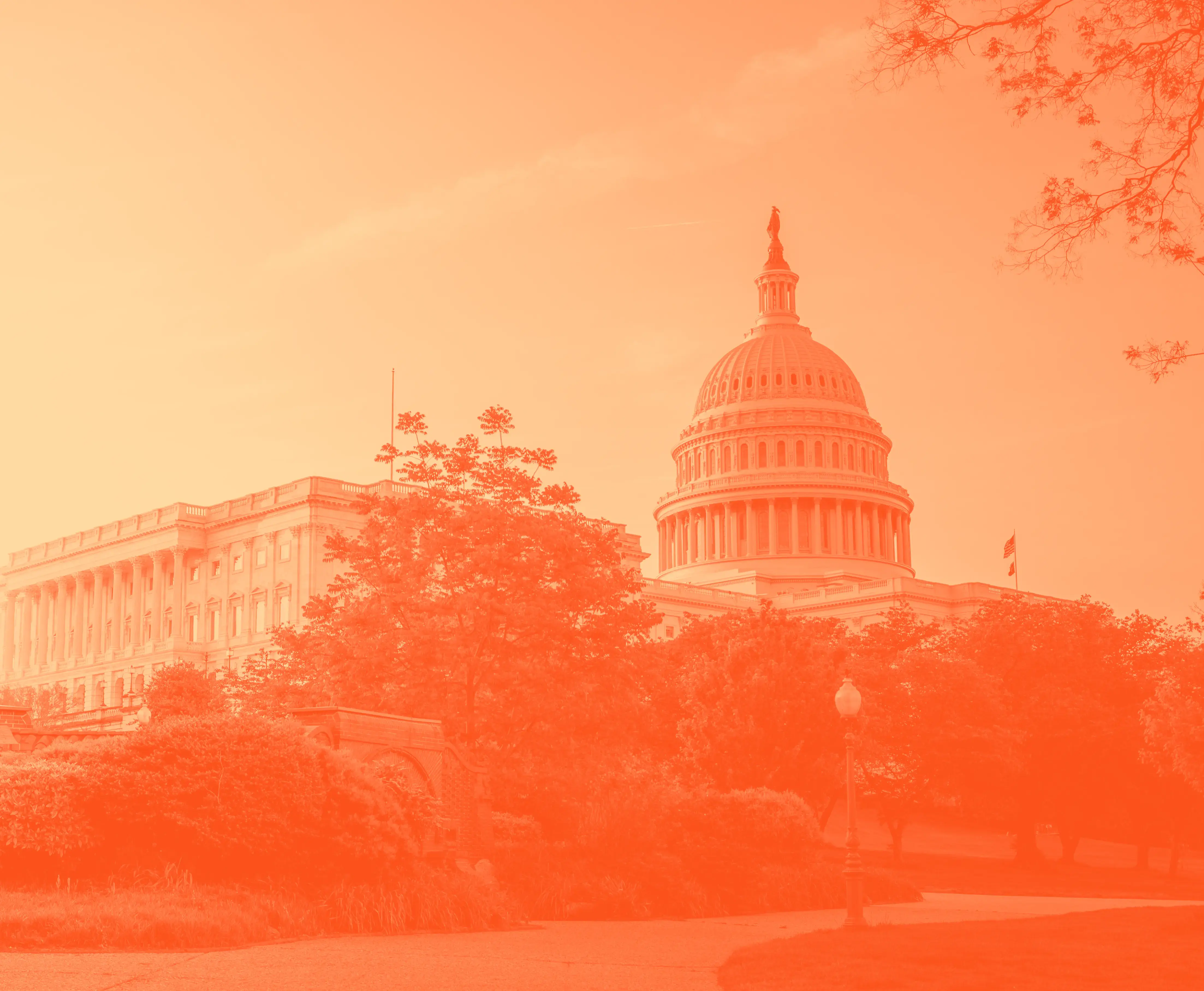 The U.S. Capitol Building with an orange hue.